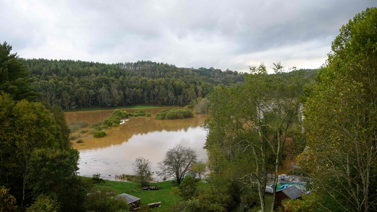 Hay bales and other debris floated down the New River in Ashe County in Boone, North Carolina. Picture: Getty