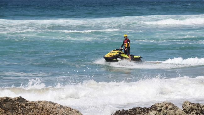 Lifesavers and police continued their search around Elephant Rock at Currumbin where it was feared a woman was swept off the rocks. Picture Glenn Hampson