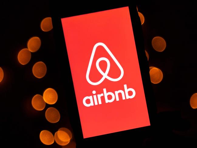 (FILES) This file illustration photo taken on November 22, 2019 shows the logo of the online lodging service Airbnb displayed on a tablet in Paris. - Airbnb and DoorDash make their stock market debut this week as part of a "unicorn parade" capping a busy year for hot startups going public. The startups known as unicorns -- valued in the billions -- are poised to take advantage of a market hungry for young businesses promising fast growth, with some taking advantage of lifestyle changes due to the pandemic. (Photo by Lionel BONAVENTURE / AFP)