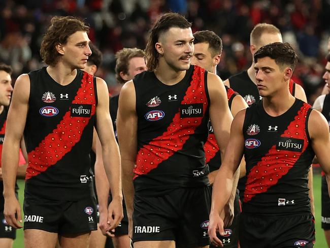 MELBOURNE, AUSTRALIA - APRIL 25: The Bombers walk off after the round seven AFL match between Essendon Bombers and Collingwood Magpies at Melbourne Cricket Ground, on April 25, 2024, in Melbourne, Australia. (Photo by Robert Cianflone/Getty Images)