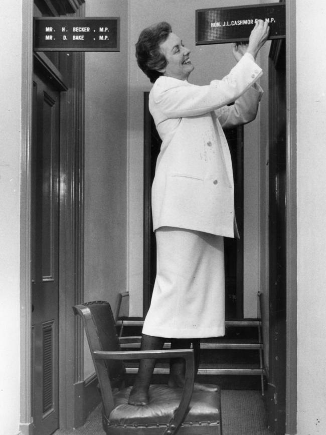 Politician Jennifer Cashmore changing her name on her Parliament House office entrance back to her maiden name. Picture: Campbell Brodie