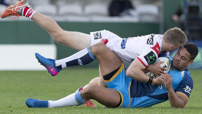 Matthew Dufty of the Dragons tackles Jarryd Hayne. Picture: AAP