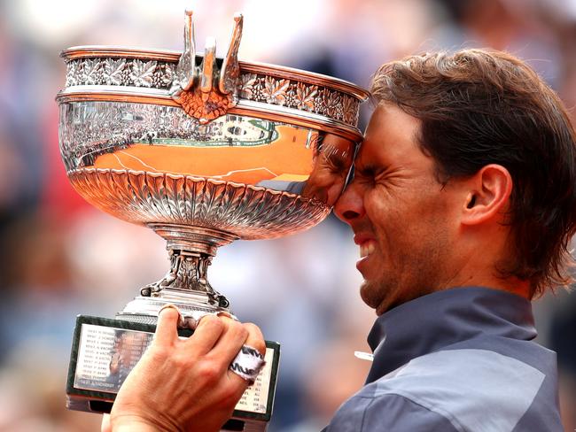 PARIS, FRANCE - JUNE 09: Rafael Nadal of Spain celebrates with the trophy following the mens singles final against Dominic Thiem of Austria during Day fifteen of the 2019 French Open at Roland Garros on June 09, 2019 in Paris, France. (Photo by Clive Brunskill/Getty Images)