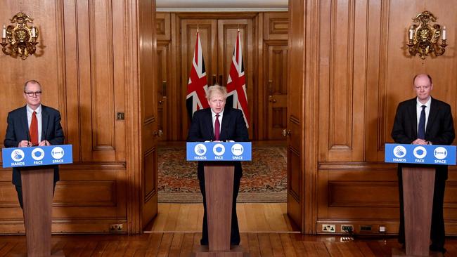 Britain's Prime Minister Boris Johnson (centre), chief medical officer for England Chris Whitty (right) and Britain's chief scientific adviser Patrick Vallance announcing a "stay at home" order for London and southeast England on Saturday. Picture: Toby Melville/AFP