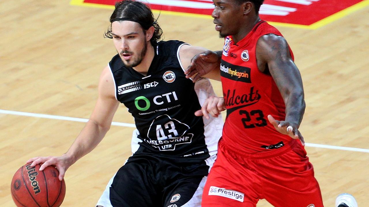 Chris Goulding of United runs the ball up the court under pressure from Casey Prather of the Wildcats during the NBL Match Melbourne United versus the Perth Wildcats at Hisense arena in Melbourne on Sunday 27th December, 2015. Picture: Mark Dadswell