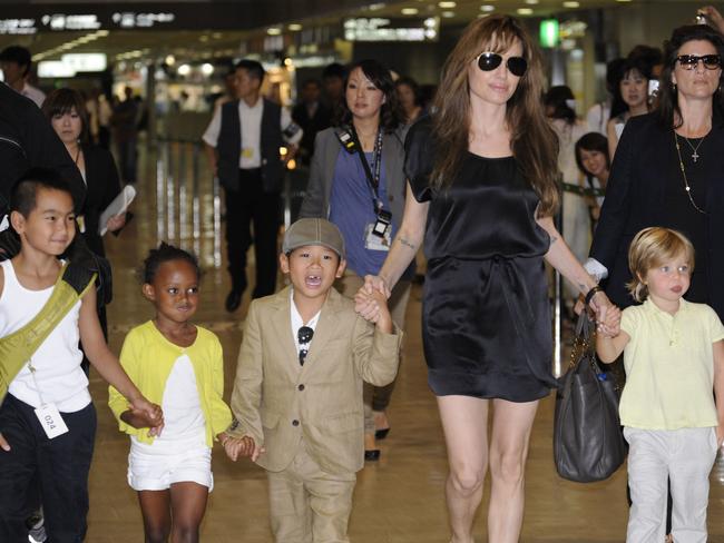 The gang’s (almost) all here (l-r): Maddox, Zahara, Pax and Shiloh with their mother. Picture: AFP/ Yoshikazu Tsuno