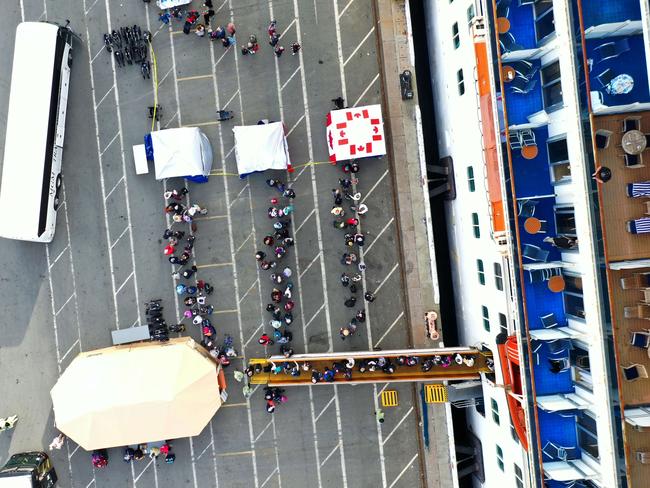 Passengers disembark from the Princess Cruises Grand Princess cruise as it sits docked in the Port of Oakland. Picture: Getty Images/ AFP