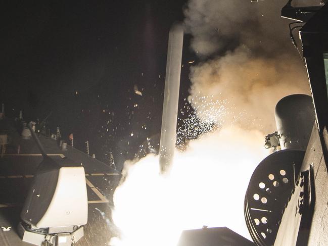 In this image released by the US Navy, the USS Ross fires a tomahawk land attack missile April 7, 2017, at a Syrian air force airfield . US President Donald Trump ordered a massive military strike on a Syrian air base on Thursday in retaliation for a "barbaric" chemical attack he blamed on President Bashar al-Assad. / AFP PHOTO / US NAVY / Robert S. PRICE / RESTRICTED TO EDITORIAL USE - MANDATORY CREDIT "AFP PHOTO / US NAVY / Mass Communication Specialist 3rd Class Robert S. Price" - NO MARKETING NO ADVERTISING CAMPAIGNS - DISTRIBUTED AS A SERVICE TO CLIENTS