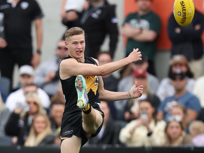 Flynn Young gets a kick away for the Tigers. Picture: Rob Lawson/AFL Photos via Getty Images