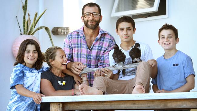 Pictured at their home in Newport with their adopted birds: Sam and Cameron, Oli, Noah and Reuben. Picture: Richard Dobson