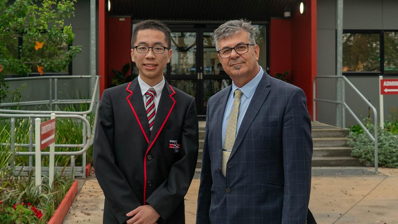 North Geelong Secondary College dux Haisong Qi (left) with principal Nick Adamou.