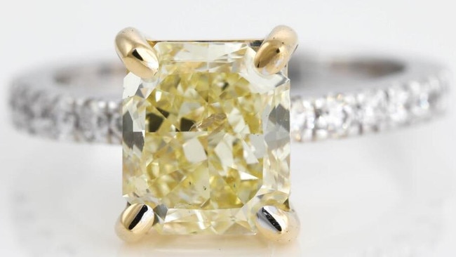 A yellow diamond ring worth up to $24,000 will be sold at First State Auctions' liquidation sale.