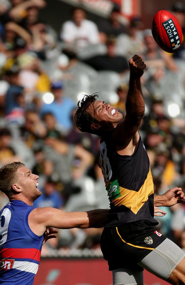 Alex Rance beats then Bulldog Jake Stringer to the ball in Round 2, 2015. Picture: Colleen Petch.