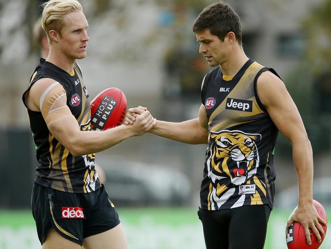 Steven Morris (left) welcomes Chris Knights back from the AFL wilderness. Picture: Colleen Petch