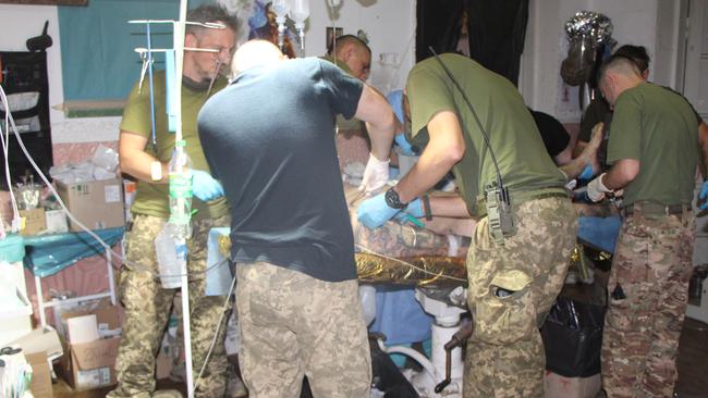 Medics attend to a wounded Ukrainian soldier. Picture: Jonathan Spyer