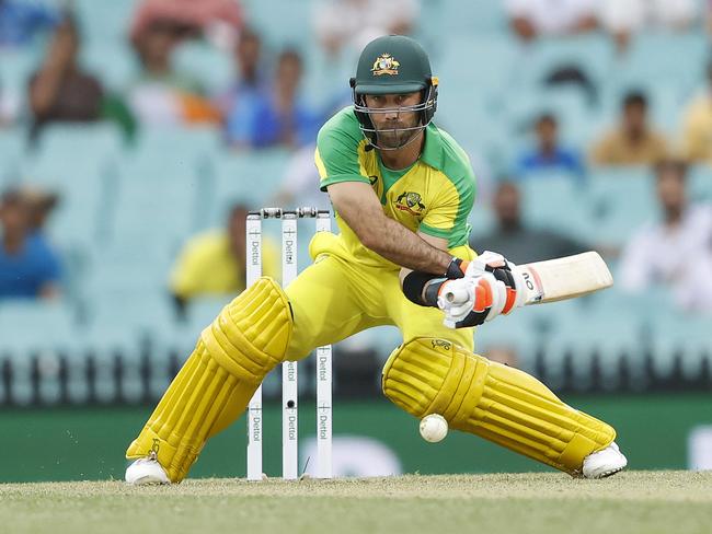 Australia's Glenn Maxwell reverse sweeps during the One-Day International between Australia and India at the SCG. Picture. Phil Hillyard