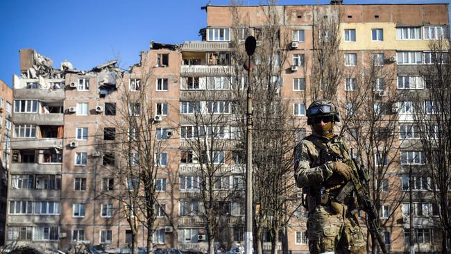 A Russian soldier outside a damaged apartment building in Donetsk, the capital of eastern Donbas region occupied by Moscow-backed separatists. Picture: AFP