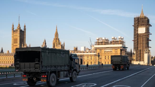 Military vehicles cross London’s Westminster Bridge. Boris Johnson has announced strict lockdown measures urging people to stay at home and only leave the house for basic food shopping and exercise once a day.