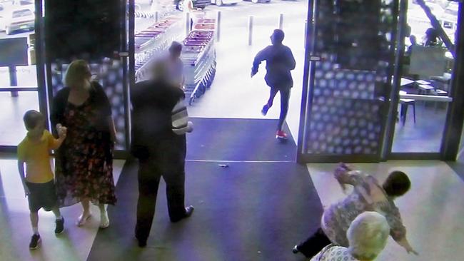 An elderly woman suffered a fractured pelvis after she was knocked over by a group fleeing the scene of a robbery in a shopping centre in Casula.