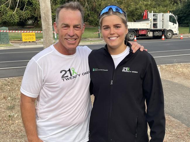 North Melbourne and AFL premiership coach Alistair Clarkson with Delaney Troon who is running 21 half marathons in 21 days. Picture: Shane Jones.