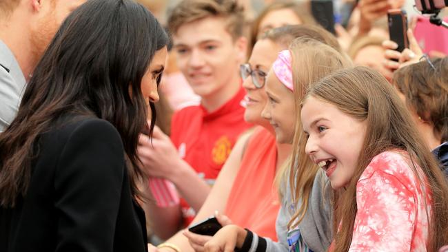 This young girl was delighted to meet Meghan. Picture: AFP Photo/Pool/Gerry Mooney