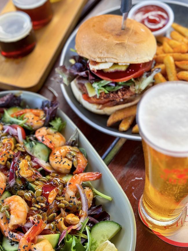 The Wobby Chook Brewing Co’s burger and Thai prawn salad with beers. Picture: Jenifer Jagielski