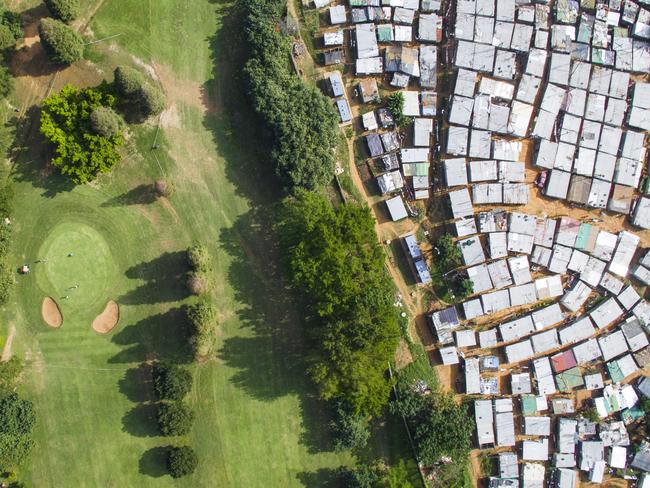 Unequal Scenes: Segregation of urban spaces in South Africa. Picture: Johnny Miller/Millefoto/Rex Shutterstock/Australscope