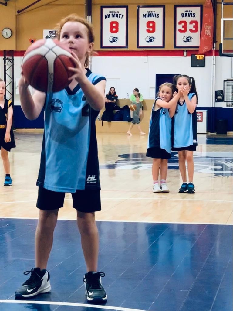 SA Little Legend Mila Kane, 7, Seacliff School, captured her first goal for her school basketball team as her teammates watched on in support. Picture supplied.