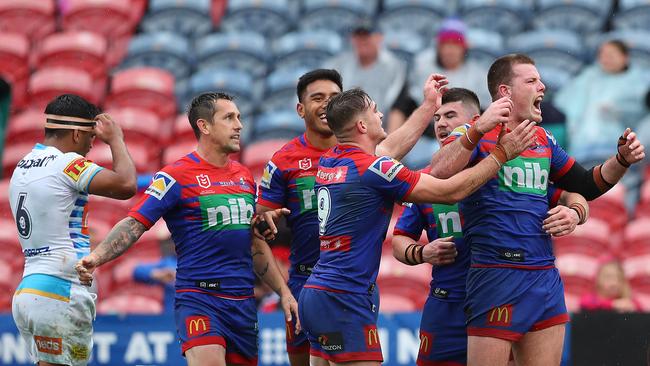 Lachlan Fitzgibbon of the Newcastle Knights celebrates a try with team mates during the round 24 NRL match at McDonald Jones Stadium. Photo by Tony Feder/Getty Images