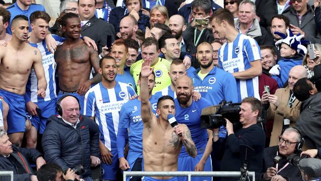 Brighton and Hove Albion's Anthony Knockaert centre, leads the celebrations.