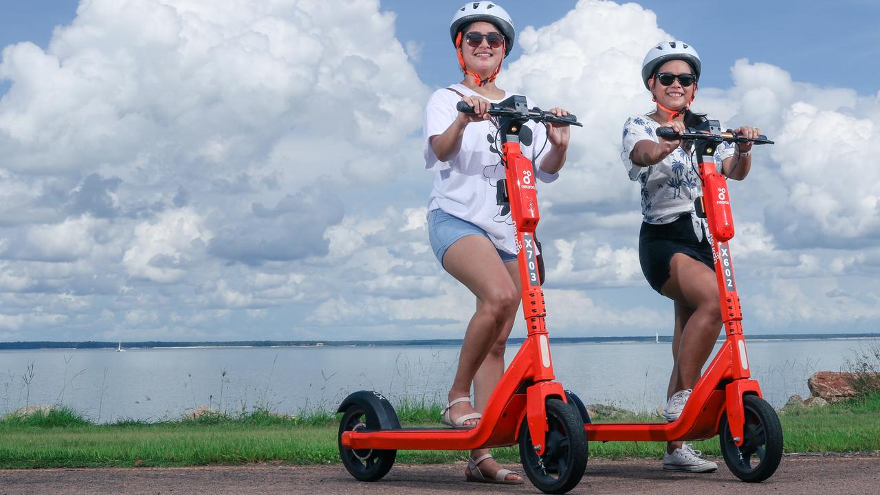 More Darwinites are using e-scooters as a result of increasing fuel prices Nicola Wickramaratne (L) and Mei Li Chang are locals who have turned to e-scooters. Picture: Glenn Campbell