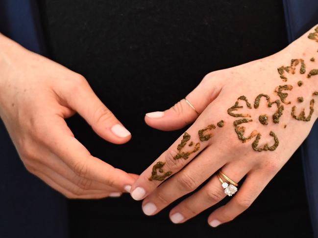 Meghan, Duchess of Sussex attends a Henna tattoo ceremony as she visits a boarding house in the town of Asni, Morocco. Picture: Getty