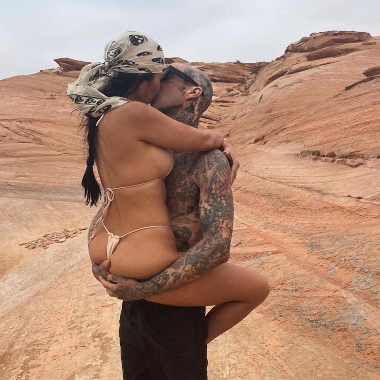 Kourtney and Travis pack on the PDA in the desert.