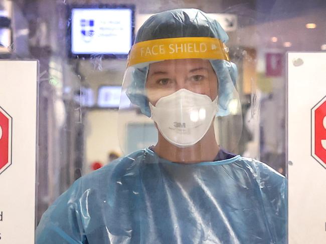 Head nurse of RMH's covid ward, Grace Carroll, has had covid twice. She says nurses are bracing for more pain to come now with school returning, and a big wave of PTSD will come crashing down soon on overworked nurses. Grace in the infectious disease unit, dressed in her PPE.                    Picture: David Caird