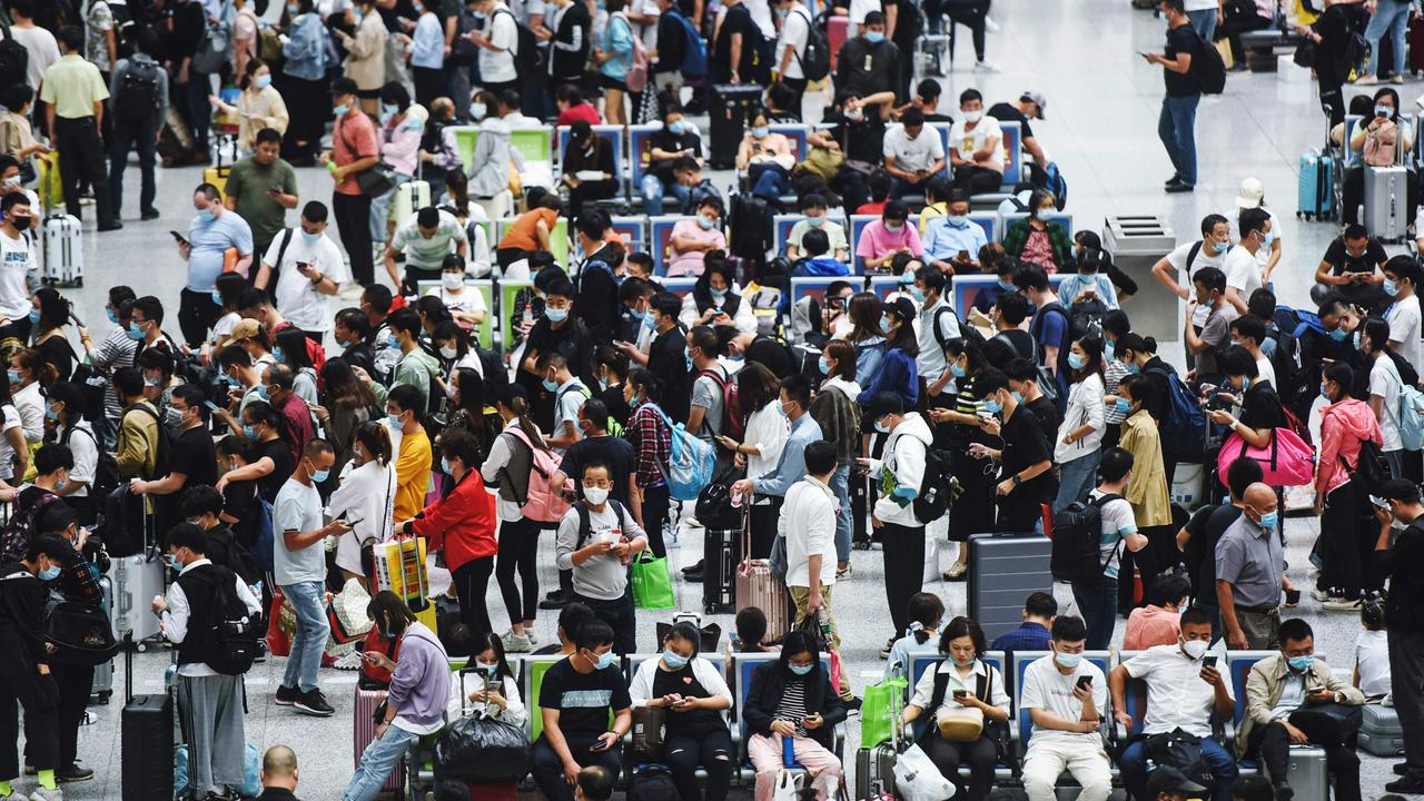 Passengers wait for trains at Hangzhou East train station, in China’s eastern Zhejiang province, amid a travel boom on September 30. Picture: STR/AFP