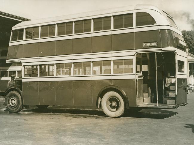 An MTT driver, left, with a diesel double-decker bus in 1936.