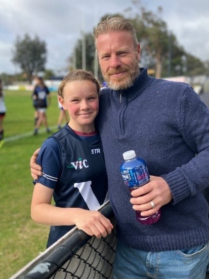 Bass Valley Primary School student Beth Grenness, pictured with her father Tim, is hitting the football big leagues after being selected for the Victorian state team.