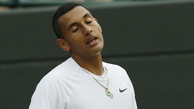 Nick Kyrgios of Australia reacts after losing a point against Milos Raonic in the Wimbledon quarter-finals.