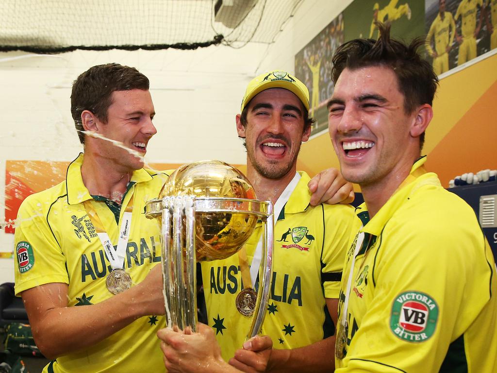 Josh Hazlewood, Mitchell Starc and Pat Cummins in the dressing rooms after Australia defeated New Zealand in the final of the 2015 ICC Cricket World Cup at the MCG. Picture: Phil Hillyard