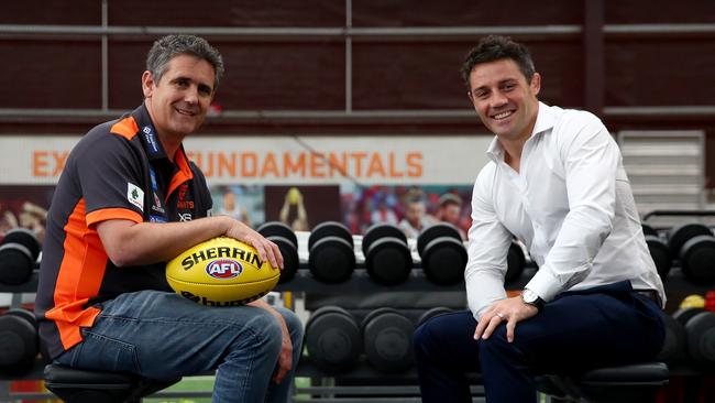 Cooper Cronk chats with GWS Giants coach Leon Cameron at Giants HQ. Picture: Toby Zerna