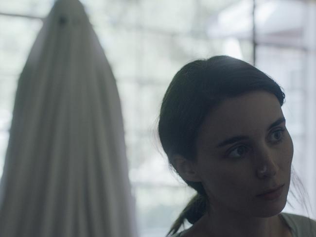 This image released by A24 shows Rooney Mara in a scene from the film, "A Ghost Story." (Bret Curry/A24 via AP)