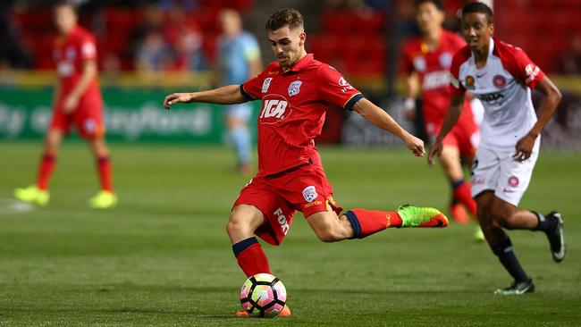SA-born left back Ben Garuccio, pictured playing for Adelaide United, has torn his anterior cruciate ligament while training with Scottish club Hearts. Picture: Paul Kane/Getty Images