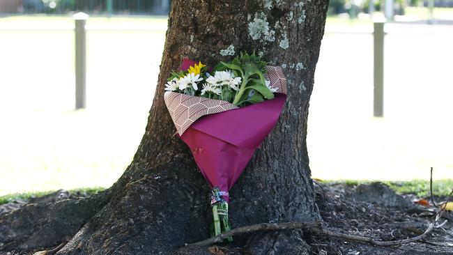 The Mooroobool Hub opposite Shang Park has been closed down. A bouquet of flowers laid in the park. PICTURE: BRENDAN RADKE