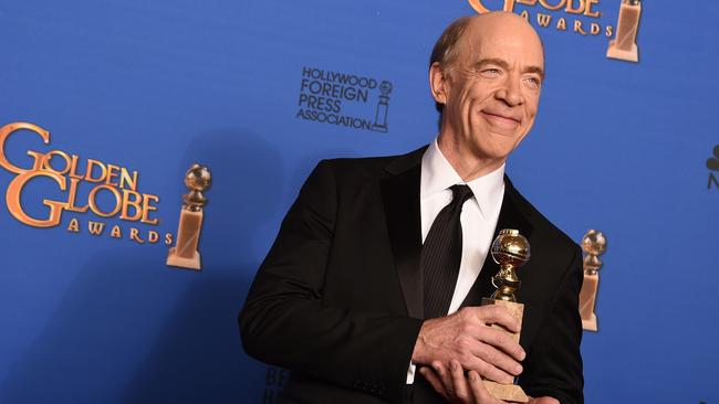 Happy winner ... J.K. Simmons poses in the press room with the award for Best Supporting Actor in a Motion Picture — Drama, Musical or Comedy for <i>Whiplash</i>. Picture: AP