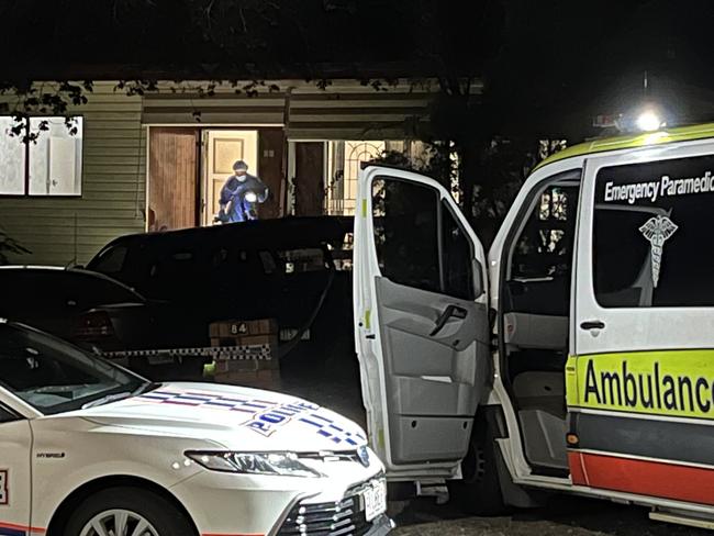 Police and ambulance officers at the scene where two bodies were found in Brisbane's outer southwest. Picture: Shaye Windsor