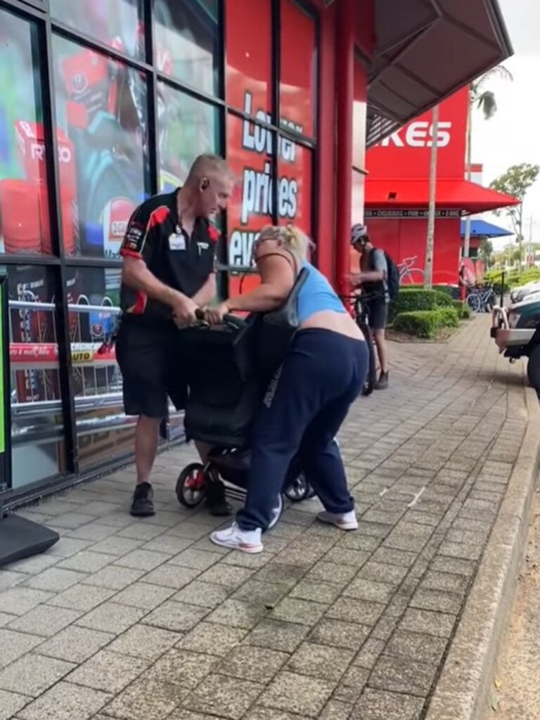 The man was filmed stopping a woman who allegedly attempted to take something from the store. Picture: TikTok