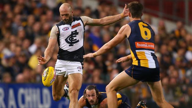 PERTH, AUSTRALIA - APRIL 10: Chris Judd of the Blues clears the ball during the round two AFL match between the West Coast Eagles and the Carlton Blues at Domain Stadium on April 10, 2015 in Perth, Australia. (Photo by Paul Kane/Getty Images)