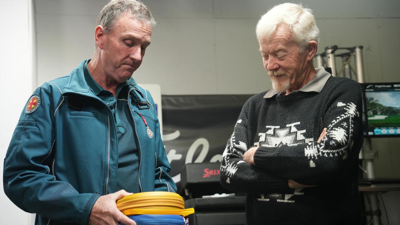 Queensland Ambulance Service Toowoomba officer-in-charge Peter Baron (left) wants to see more businesses and sporting clubs holding automated external defibrillators (AEDs) after the deployment of one saved Allen Longridge's life at the City Golf Club.