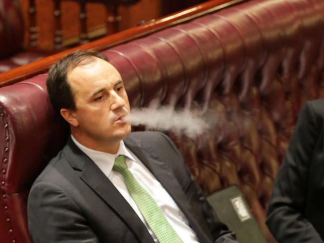 Greens MLC Jeremy Buckingham in question time in the NSW Upper House "vapes" from a vapour cigarette.