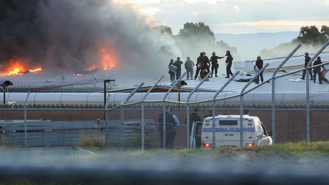 Sections of the prison were engulfed with flames before specialist riot police brought it under control. Picture: Justin Lloyd.